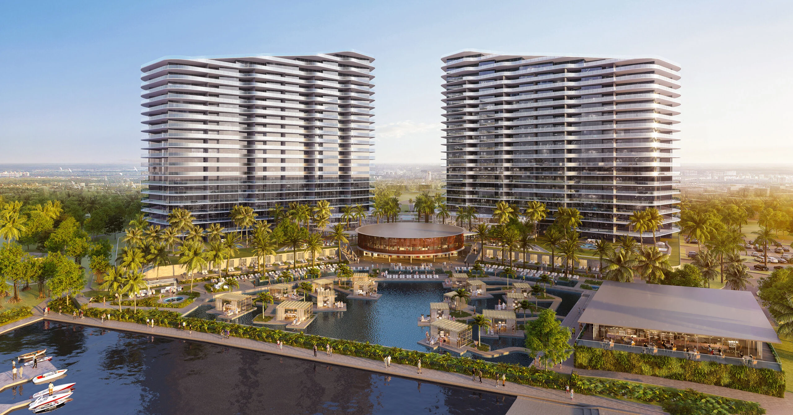 The exterior construction of a luxury high-rise residential tower overlooking a tranquil bay and nature preserve in Southwest Florida.